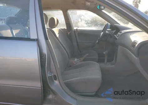 2001 Toyota Corolla Ce from USA, damaged, VIN 1NXBR12E21Z547824